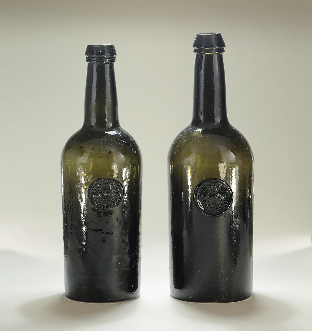 TWO DARK GREEN GLASS SEALED CYLINDER WINE BOTTLES , England, c1800